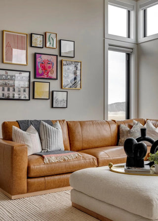 Hero image of the Prague Sectional Sofa in a modern living room, front-facing view showcasing its structured silhouette, spacious seating, and refined upholstery.