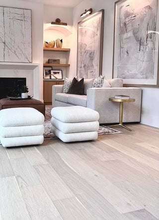Hero image of a living room featuring the Clint Sofas and Classic Charm Ottoman, styled with soft tones and layered textures for a warm, inviting atmosphere.