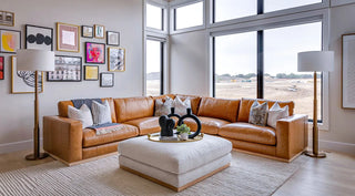 Hero image of the Prague Sectional Sofa in a modern living room, front-facing view showcasing its structured silhouette, spacious seating, and refined upholstery.