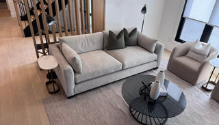 Top view of the Raven Sofa in a styled living room, highlighting its sleek lines, plush cushions, and balanced proportions from above.