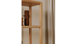 Close-up view of the Jousie Bookshelf on a white background, focusing on the shelf details, material texture, and craftsmanship.